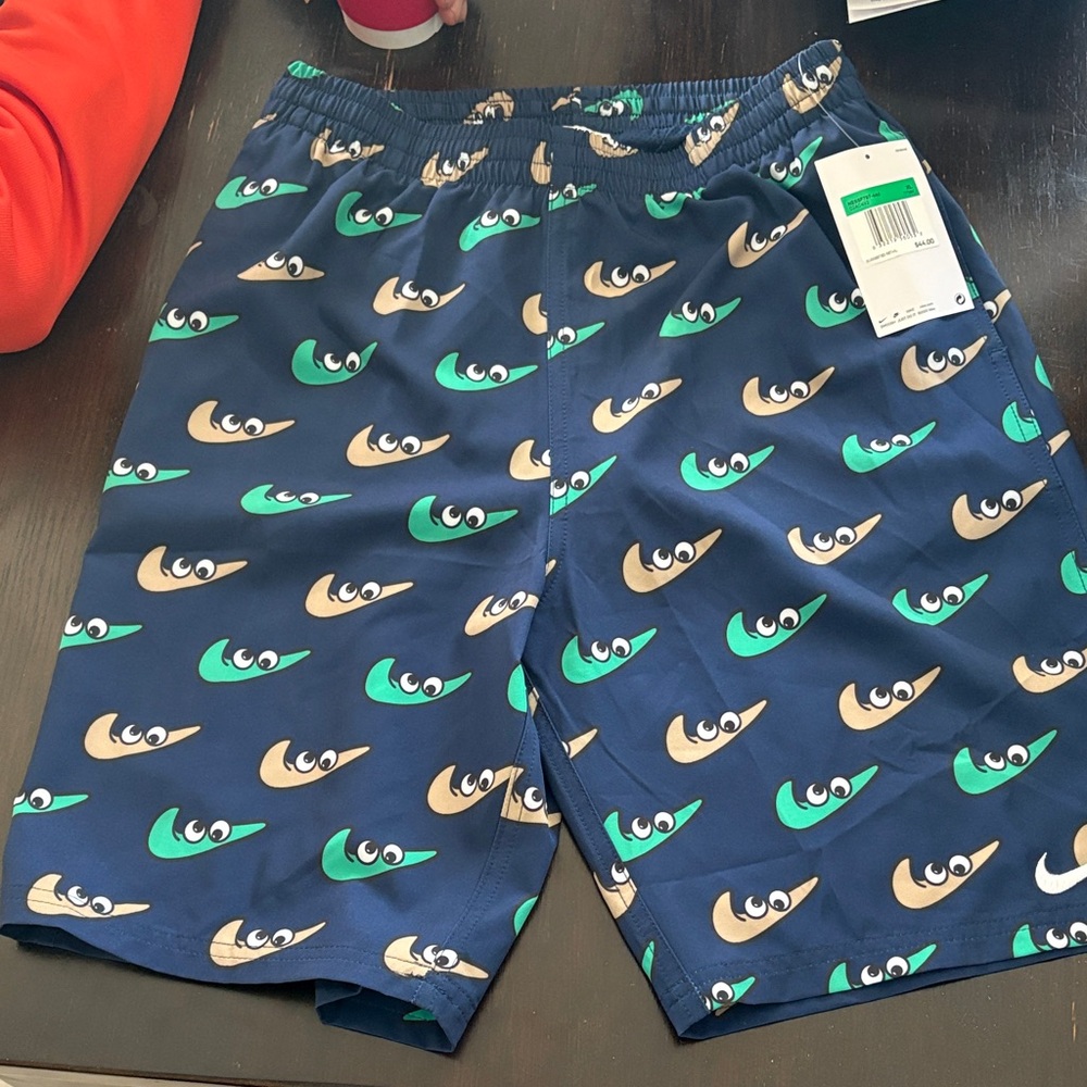 Blue Patterned Nike Swim Shorts with Eye Swoosh Design